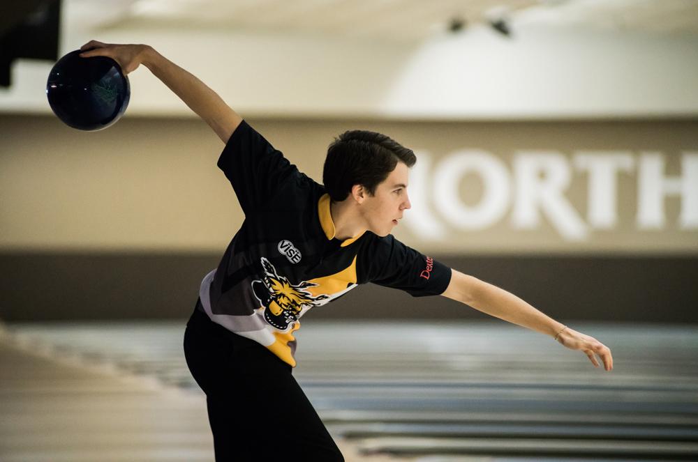 Justin Zwaschka, a junior from St. Joseph, Missouri, slides into a release Sunday at North Rock Lanes in Wichita.