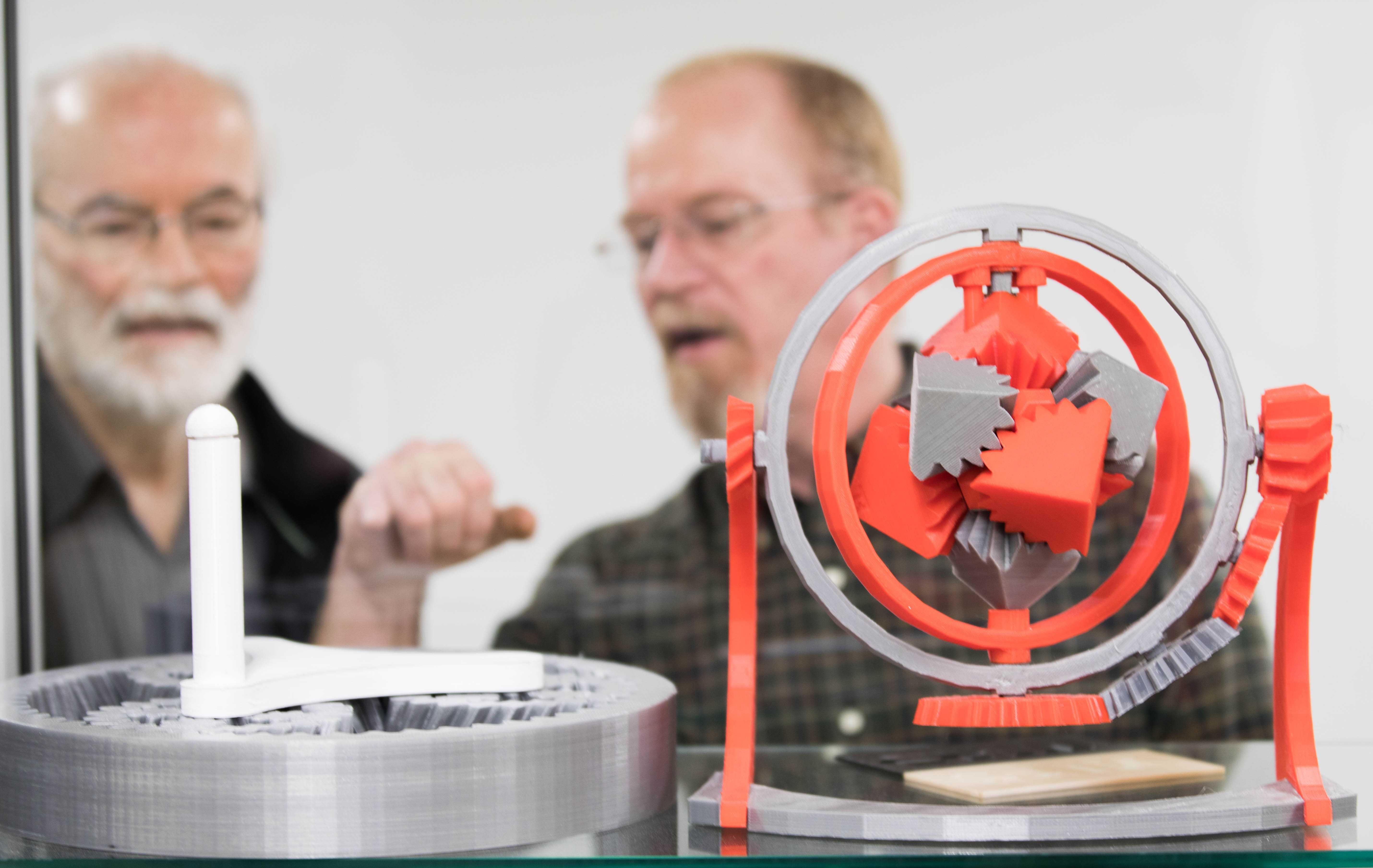 Ken Tedder and Steve Copeland, staff for electrical engineering, looks at an intricate 3-D models made with equipment at the Experiential Engineering Building. The Experiential Engineering Building will offer 3-D printers for students, faculty and the community. (Jan. 17, 2017)