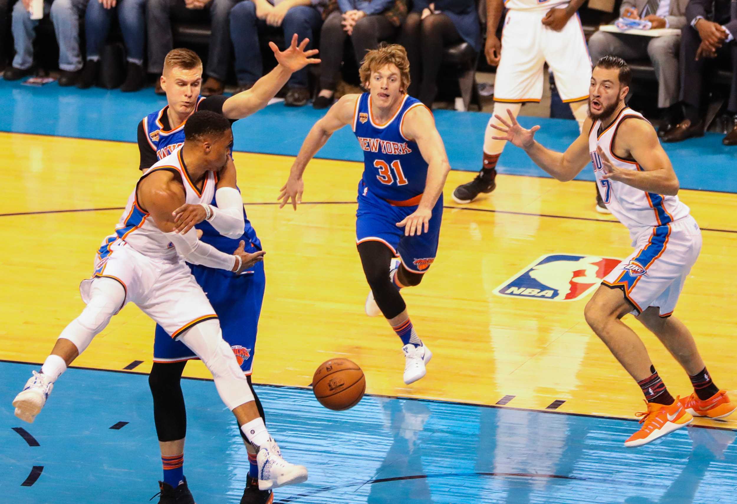 Former Wichita State Shocker Ron Baker, center, lunges for a ball, when the New York Knicks played the Oklahoma City Thunder in Chesapeake Energy Arena. Baker played a total of 18 minutes. (Feb. 15, 2017)