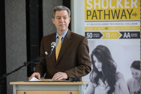 Gov. Brownback signs bill to join WSU, WATC