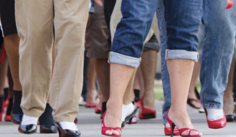 Students unite on campus to raise awarness towards sexual abuse by participating in a mile walk in heels.
