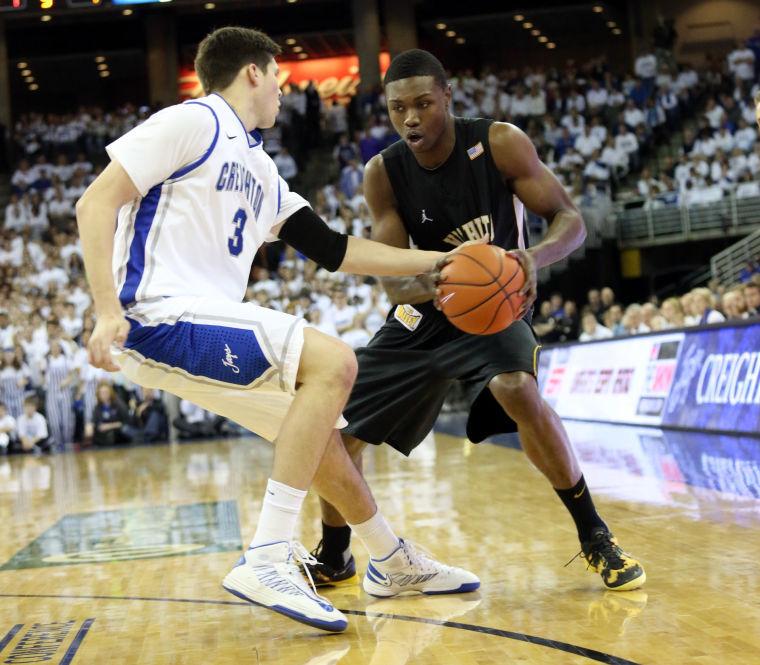 Wichita State's Cleanthony Early is defended by Creighton's Doug McDermott.