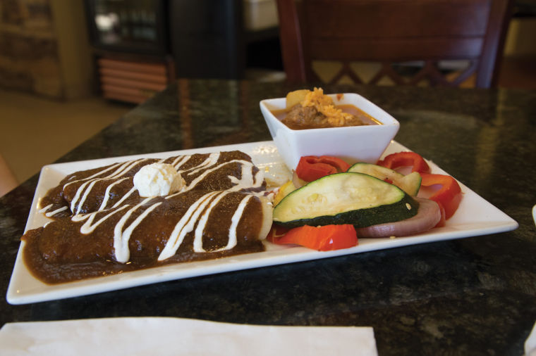 Chipotle+enchiladas+with+grilled+veggies+and+Albondigas+soup+from+Molinos+Mexican+Cuisine+at+1064+N.+Waco.+Molinos+has+offered+traditional+and+contemporary+cuisine+for+five+years.
