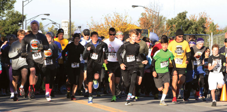 Dozens dash from the starting line to kick off this year's Pumpkin Run.