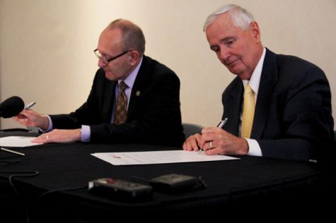 On Tuesday at the Marcus Welcome Center, Wichita State University President John Bardo and Emporia State President Michael Shonrock sign a dual-degree program, negotiated by the two universities.