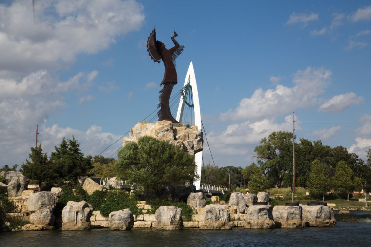 The Keeper of the Plains can be seen from the Riverwalk in downtown Wichita. The Riverwalk is a popular attraction where people can see the city from the banks of the Arkansas River.