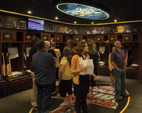 Fans view the mens basketball locker room during an open house hosted by the athletic department in October.
