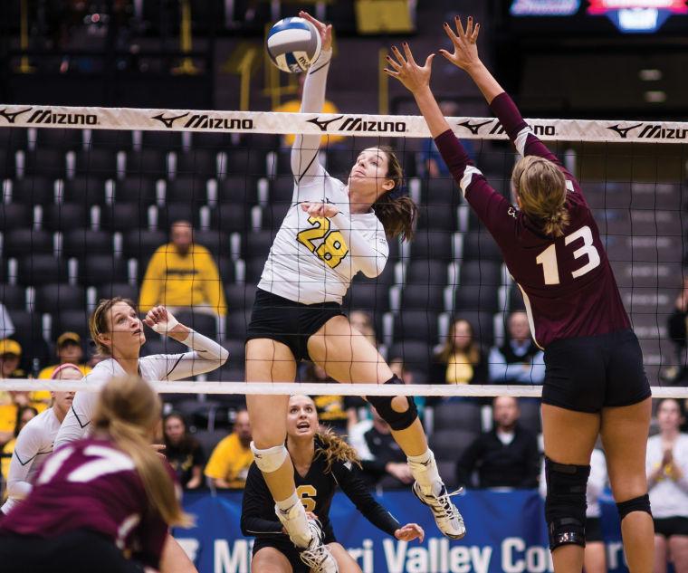 Senior+and+MVC+Tournament+MVP+Ashley+Andrade+gets+the+kill+against+Southern+Illinois+Saturday+afternoon+during+the+MVC+Championship+match+which+was+held+at+Charles+Koch+Arena.+The+Shockers+won+with+a+three+set+sweep.