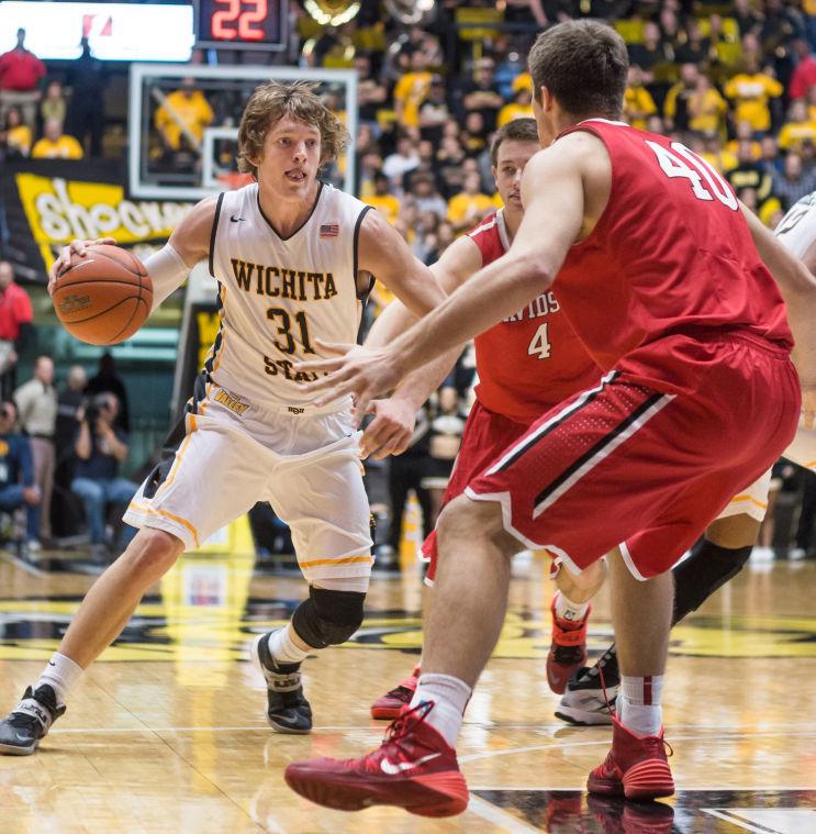 Sophomore Ron Baker drives towards the basket during Sundays afternoon game against Davidson inside Charles Koch Arena. Ron Baker scored 15 points and led the team with five assists as the Shockers are undefeated with a record of 13-0.