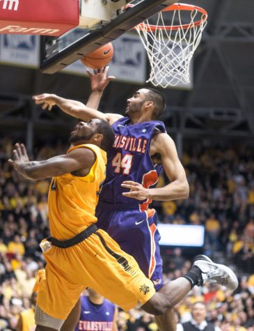 Senior Kadeem Coleby gets fouled hard from behind as he goes for a layup against an Evansville defender Saturday afternoon at Charles Koch Arena. The Shockers beat the Purple Aces to earn their 23rd consecutive win and remain undefeated.