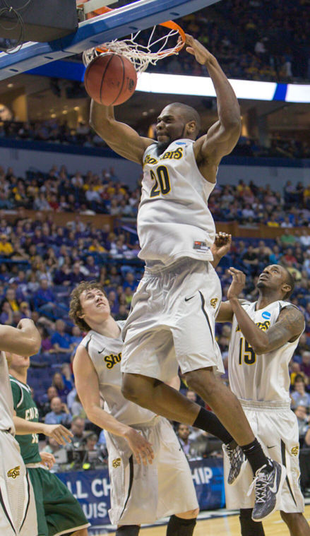 Kadeem Coleby crushes the ball down the net off an alley-oop from Fred VanVleet in Friday's game against the Cal Poly Mustangs. The Shockers won the game 64-37 to advance to the round of 32 Sunday.