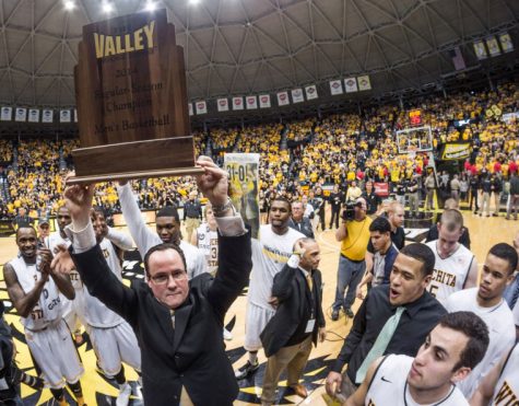 Coach Gregg Marshall holds up the MVC championship trophy Saturday afternoon inside Charles Koch Arena. The Shockers completed their historic perfect run beating Missouri State 68-45 to conclude the regular season at 31-0.