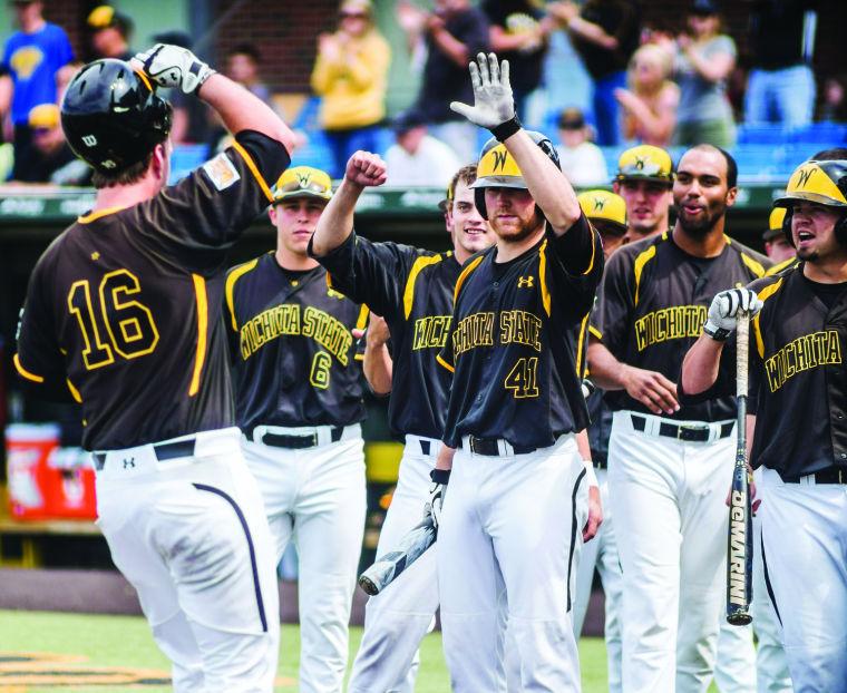 Teammates+get+ready+to+high-five+Casey+Gillaspie+after+he+hit+his+tenth+home+run+during+the+sixth+inning+to+give+the+Shockers+a+2-1+lead+at+Eck+Satdium+Saturday+afternoon.+The+Shockers+went+on+to+win+in+extra+innings+beating+Southern+Illinois+4-3+in+12+innings.