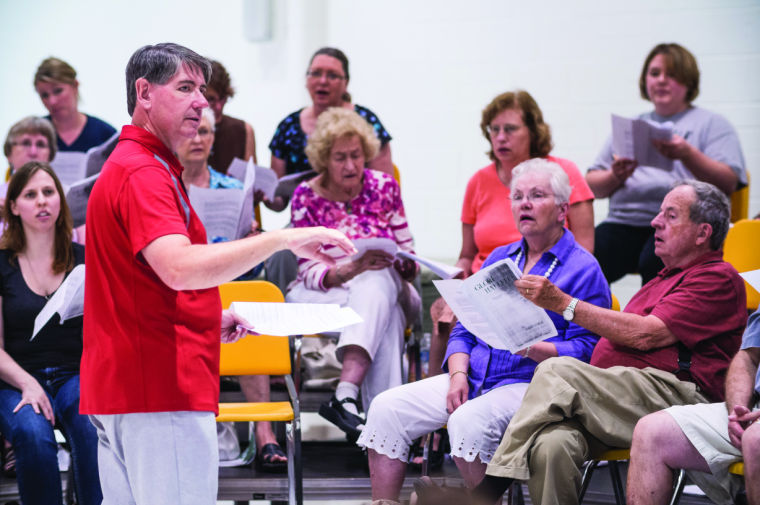 Director of Choral Activities Tom Wine conducts the WSU Summer Choir inside the Duerksen Fine Arts Center. Their concert is on Thursday, June 26, at 7:30pm in Miller Concert Hall.