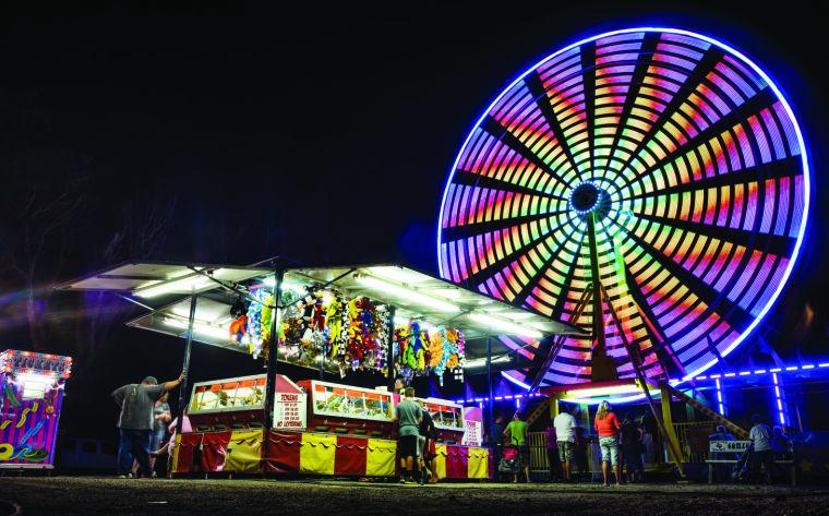 Attendees enjoy their time at the Cheney County Fair. The fair was held over the weekend in Cheney, Kansas and hundreds of people showed up.