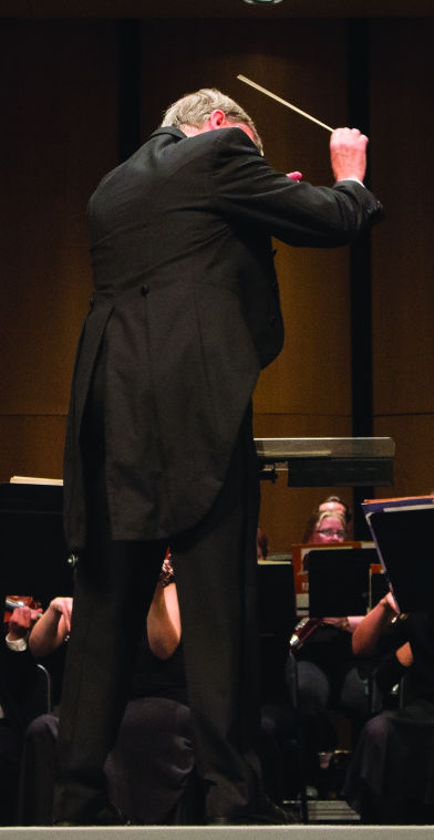 Mark Laycock, WSU Professor of Music, conducts the WSU Symphony Orchestra on July 18.