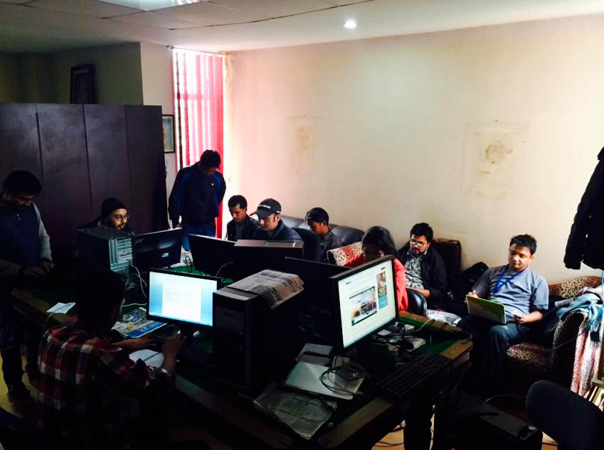Reporters for The Kathmandu Post work in a makeshift newsroom in Kathmandu, Nepal, after its home office was damaged in a magnitude 7.8 earthquake Saturday. Wichita State graudate Chahana Sigdel is covering the quake in herhometown.