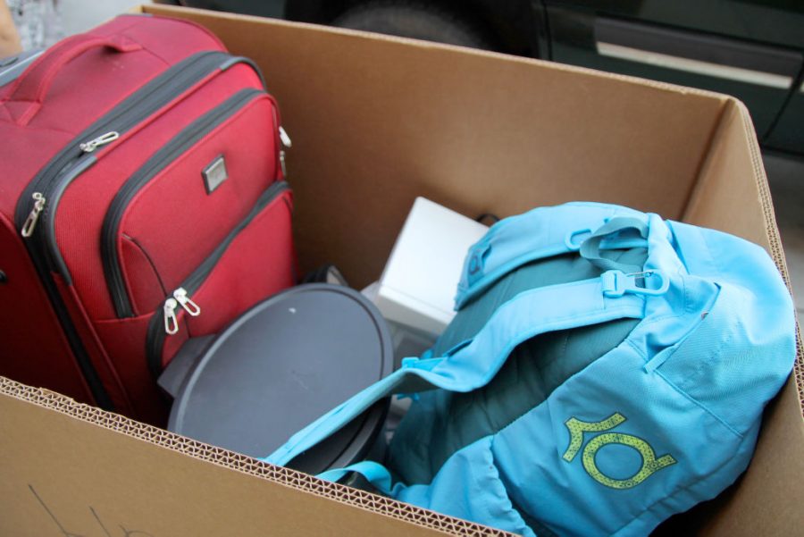 Students' belongings were packed into cardboard boxes and rolled across the Shocker Hall courtyard into dorm rooms Saturday.
