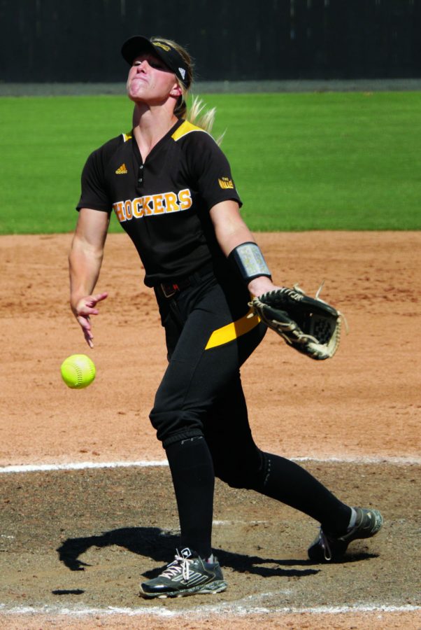 Junior+Katie+Malone+throws+out+a+pitch+early+in+Sunday%E2%80%99s+game+against+St.+Gregory.+Malone+pitched+a+no-hitter+through+seven+innings+to+help+the+Shockers+win+10-3+after+10+innings.