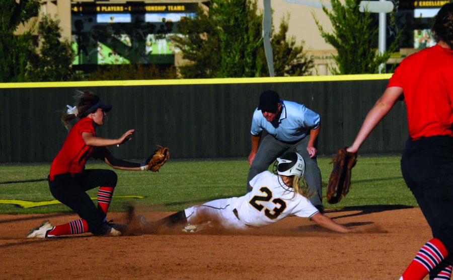 Freshman Laurie Anne Derrico slides into second base to avoid being tagged out Tuesday against Seminole; she was successful and remained safe on second. The Shockers won 16-3 to remain 8-0 so far in their fall season.