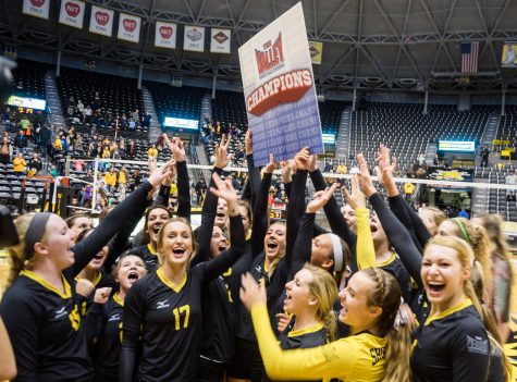 Players celebrate their sweep against Evansville on Saturday night as they clinch the program’s sixth Missouri Valley Conference championship at Charles Koch Arena.
