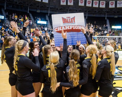 Players celebrate their sweep against Evansville Saturday night as they clinch the programs sixth Missouri Valley Conference championship at Charles Koch Arena.