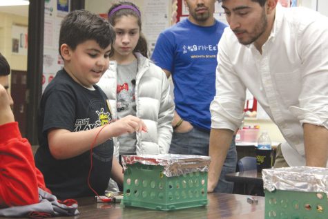Students participate in science activities with Wichita State engineering students as part of the annual “Noche de Ciencias” on Tuesday at North High School.