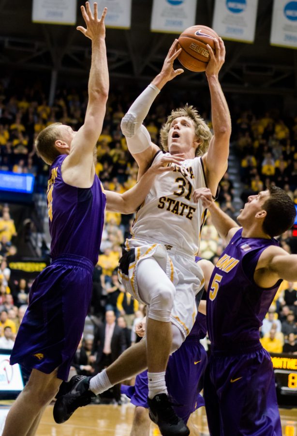 Ron+Baker+goes+up+for+a+shot+against+the+University+of+Northern+Iowa+on+Saturday.+Baker+finished+with+12+points+and+was+the+leading+scorer.+The+Panthers+defeated+the+Shockers+53-50+to+break+WSUs+home-winning+streak.