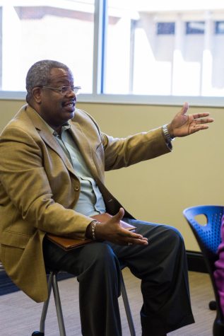 Darren Williams asks Redditt Hudson whether he believes in law enforcement’s commitment to solving race issues during a Brown Bag Discussion held by the Wichita State Office of Diversity and Inclusion on Friday afternoon. Redditt Hudson is a former St. Louis Police Officer and a co-founder of the National Coalition of Law Enforcement Officers for Justice, Reform and Accountability. Hudson answered questions from the audience about police and race relations.