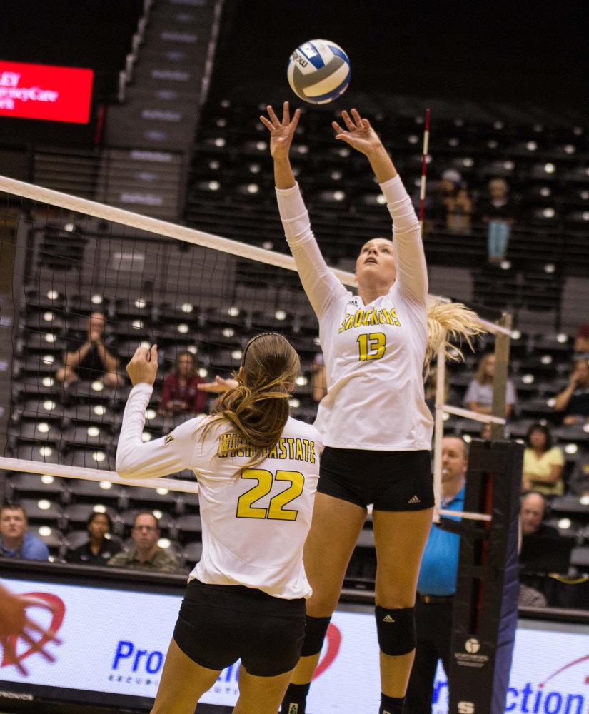Junior Emily Hiebert sets up the ball for junior Abbie Lehman in a game against IUPUI at Charles Koch Arena. Hiebert was the first WSU player to win Setter of the Year on Thursday.