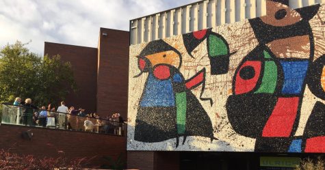 Attendants to Tuesday’s Joan Miró mosaic reception enjoy the view of the restored Personnage Oiseaux, or “Bird People,” mosaic. The mosaic’s restoration was a nine year process.