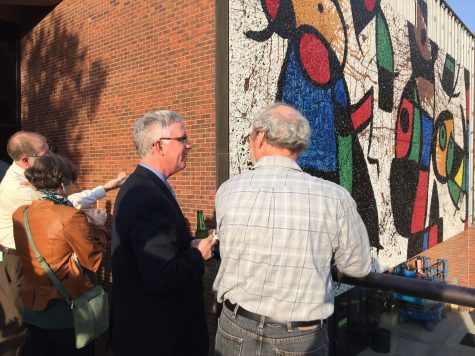 Attendants to Tuesday’s Joan Miró mosaic reception enjoy a drink and the view of the restored Personnage Oiseaux, or “Bird People,” mosaic. The mosaic’s restoration was a nine year process.