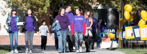 Attendees walk the final stretch of the Purple Mile. The event  was to raise awareness about domestic violence and took place at WSU Saturday morning.