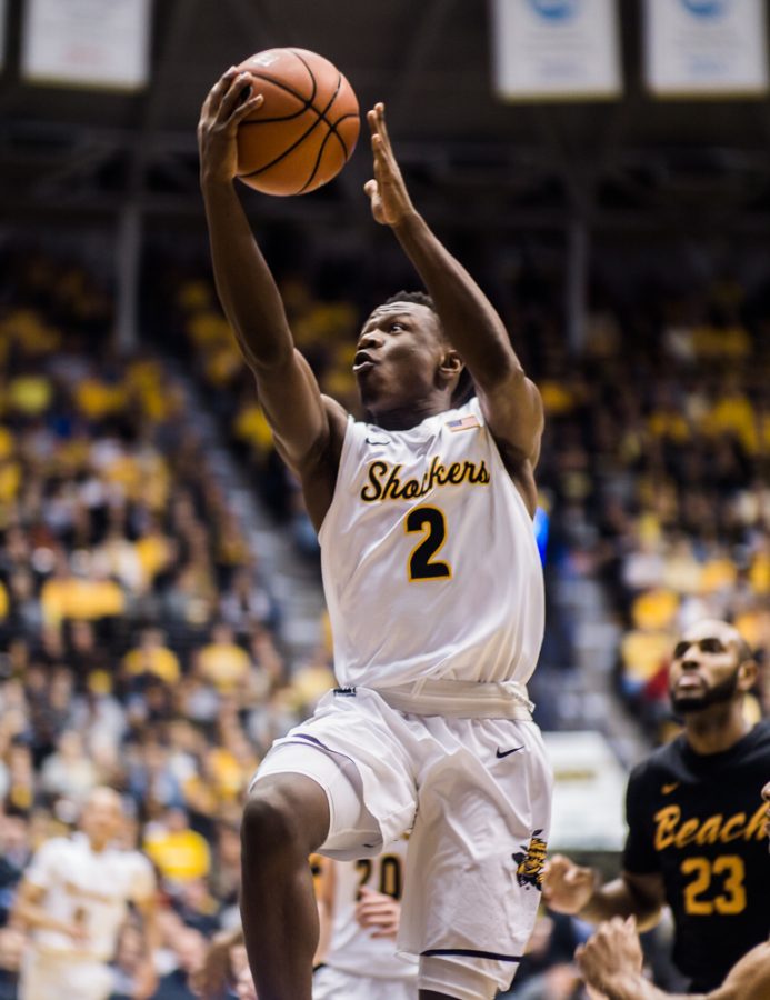 Junior Daishon Smith (2) goes for an easy lay-up in the first half against Long Beach State Sunday night at Charles Koch Arena.