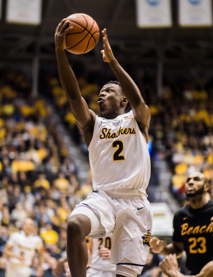Junior Daishon Smith (2) soars to the hoop in the first half against Long Beach State Sunday night at Charles Koch Arena. Wichita State rolled to a 92-55 win over Long Beach State.