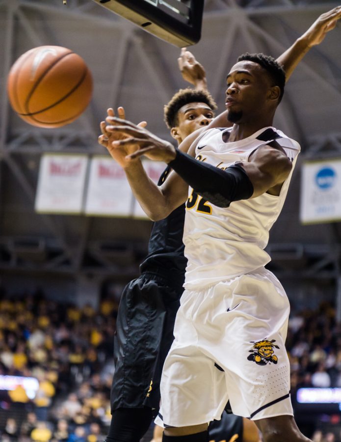 Sophomore Markis McDuffie (32) passes to an open teammate in the second half against Long Beach State Sunday night at Charles Koch Arena.