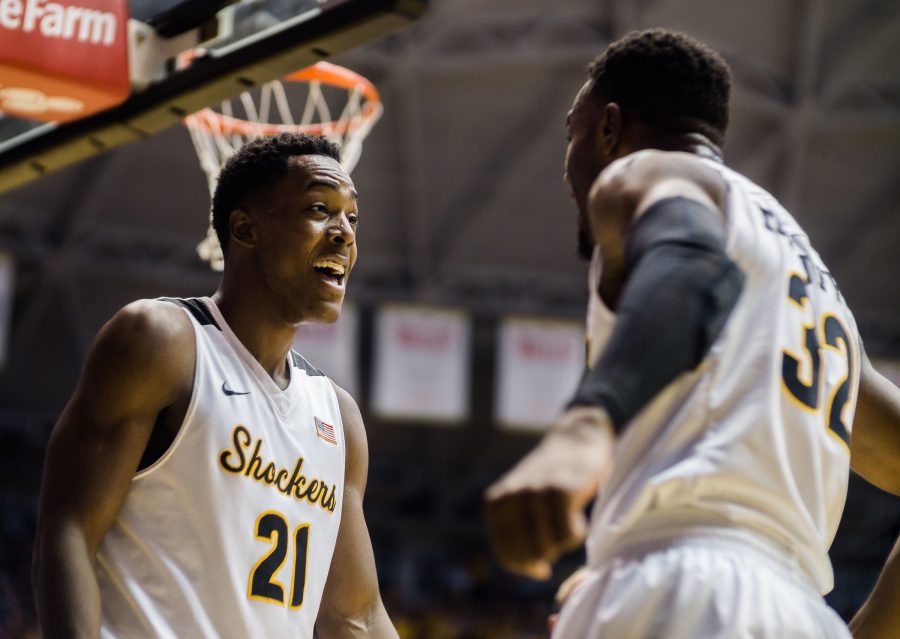 Junior forward Darral Willis (21) and teammate Markis McDuffie celebrate a play in the first half of Wednesday's game against Tulsa. McDuffie, a sophomore forward, and Willis each posted their career-bests in points. 