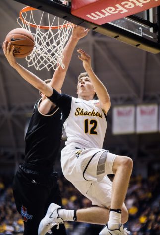 Freshman guard Austin Reeves (12) goes for a contested lay-up in the second half of Wednesday’s game against Tulsa at Charles Koch Arena. Wichita State defeated Tulsa 80-53.
