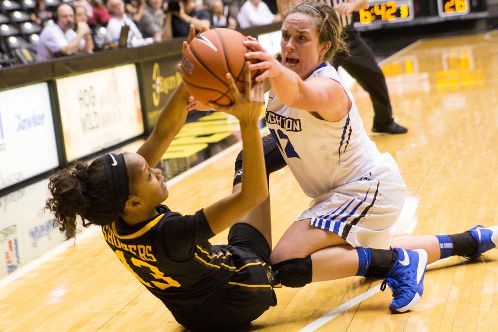 Wichita State Kayla Williams (13) and Lauren Works (12) fight for the ball in Wichita State's season opener Sunday afternoon in Koch Arena.
