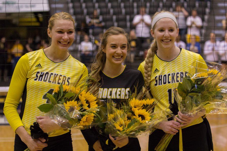 Wichita State seniors Katy Dudzinski (4), Dani Mostrom (6), and Jody Larson (11) pose together before their final home game of their college careers. The girls were given flowers during a ceremony Saturday night honoring the outgoing seniors.