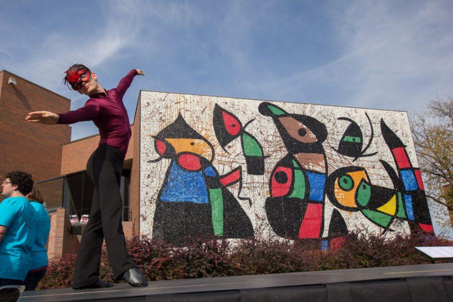 Dancers preform to a rendition of The Beatles “Black Bird” in front of the Ulrich Museum of Art at Wichita State. The dance was part of the unveiling ceremony of the restored Personnages Oiseaux (Bird People) mural.