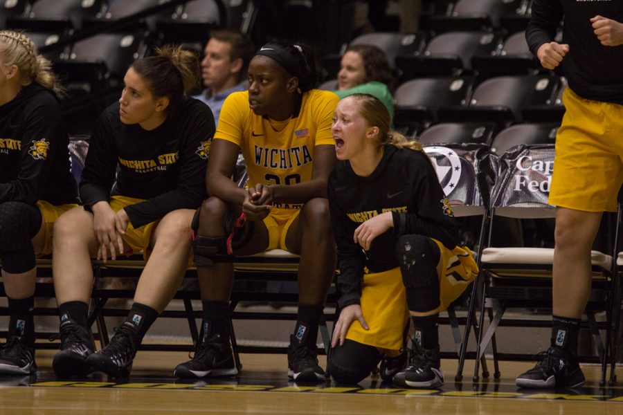 Wichita State guard Hannah Mortimer (2) cheers on her team during Wednesday night’s exhibition against Newman.