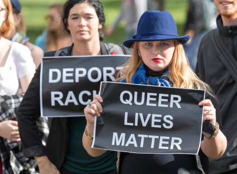 WSU alumna Erin Warry holds a sign after speaking to the crowd about President-elect Donald Trump’s misogyny in front of the RSC on Monday afternoon. “We don’t have to let this be our downfall,” Warry said.