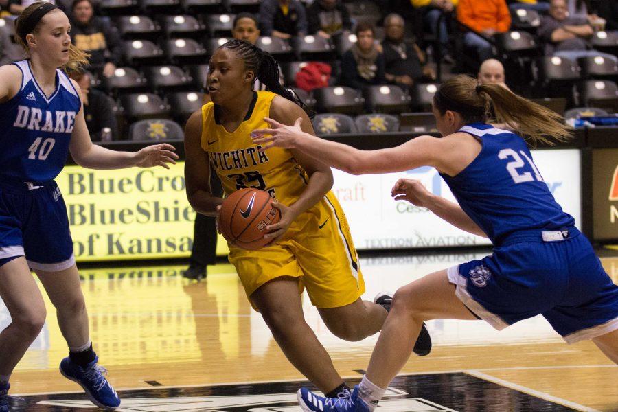 Junior forward Rangie Bessard drives to the basket against Drake. Bessard had a career-high of 32 points, but the Shockers ended up losing 83-76. 