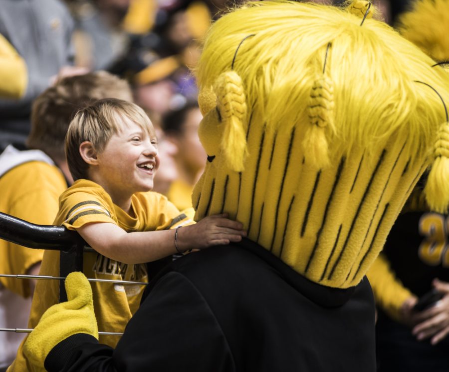 A fan hugs Wu during Wednesdays game against Drake at Charles Koch Arena. (Jan. 4, 2017)