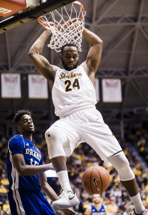 Junior center Shaq Morris (24) finishes a slam dunk in the first half Wednesday night at Charles Koch Arena.  Shaq finished the night with 13 points. (Jan. 4, 2017)