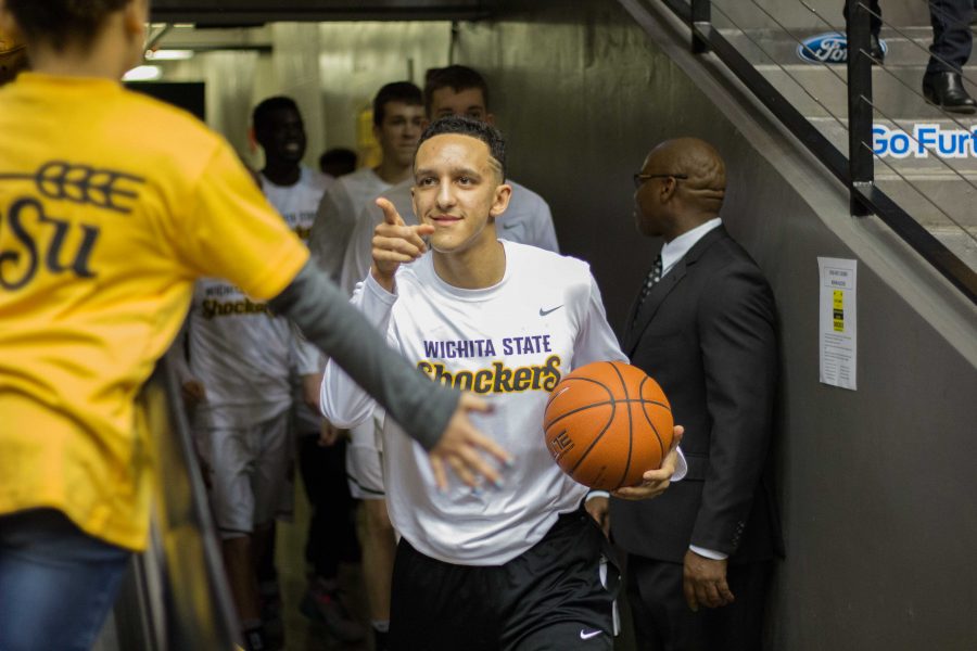 Wichita State Freshman Landry Shamet (11) points to a young fan as he exits the tunnel before Saturday’s game. Shamet had 9 points in Wichita State’s win over Indiana State. (Jan. 21, 2017) 