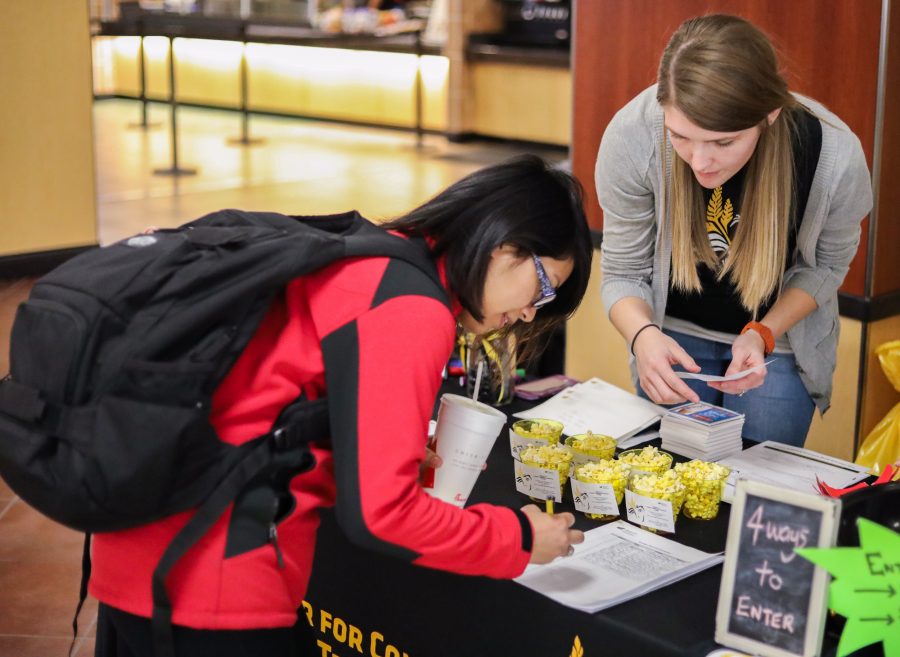Kalynn Cheyney (right) with the Center for Combating Human Trafficking speaks with a Wichita State student (left) during their awareness event in the Rhatigan Student Center. (Jan. 25, 2017)