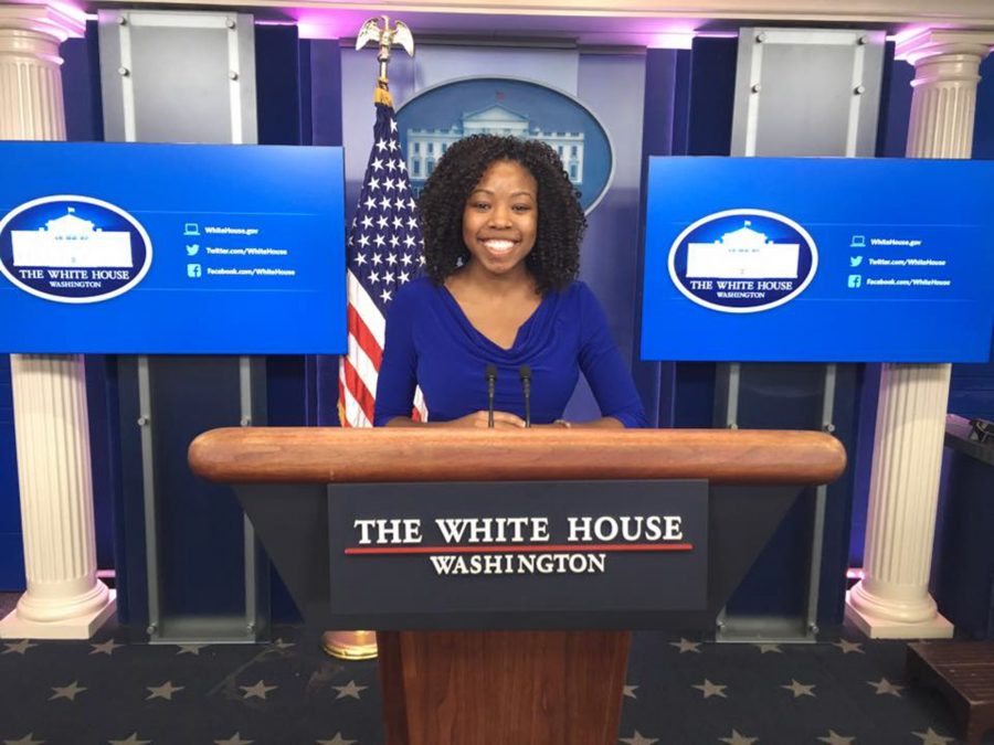 Senior Kiah Duggins poses in the White House briefing room, where then-press secretary Josh Earnest gave the daily press briefings to news media. Duggins served as a policy intern for first lady Michelle Obama’s office during the fall semester. 