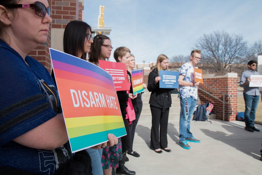 Protesters+stand+outside+the+RSC+Tuesday+afternoon.+The+Community+Psychology+Association+hosted+the+event+to+show+their+opposition+in+allowing+firearms+on+campus.